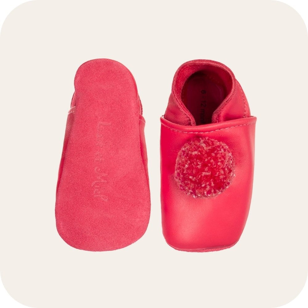 Chaussons bébé à pompons – Fuchsia