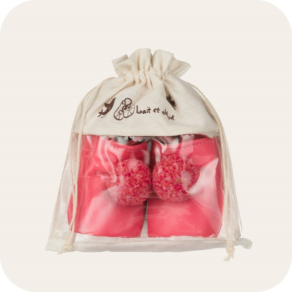 Chaussons bébé à pompons – Fuchsia
